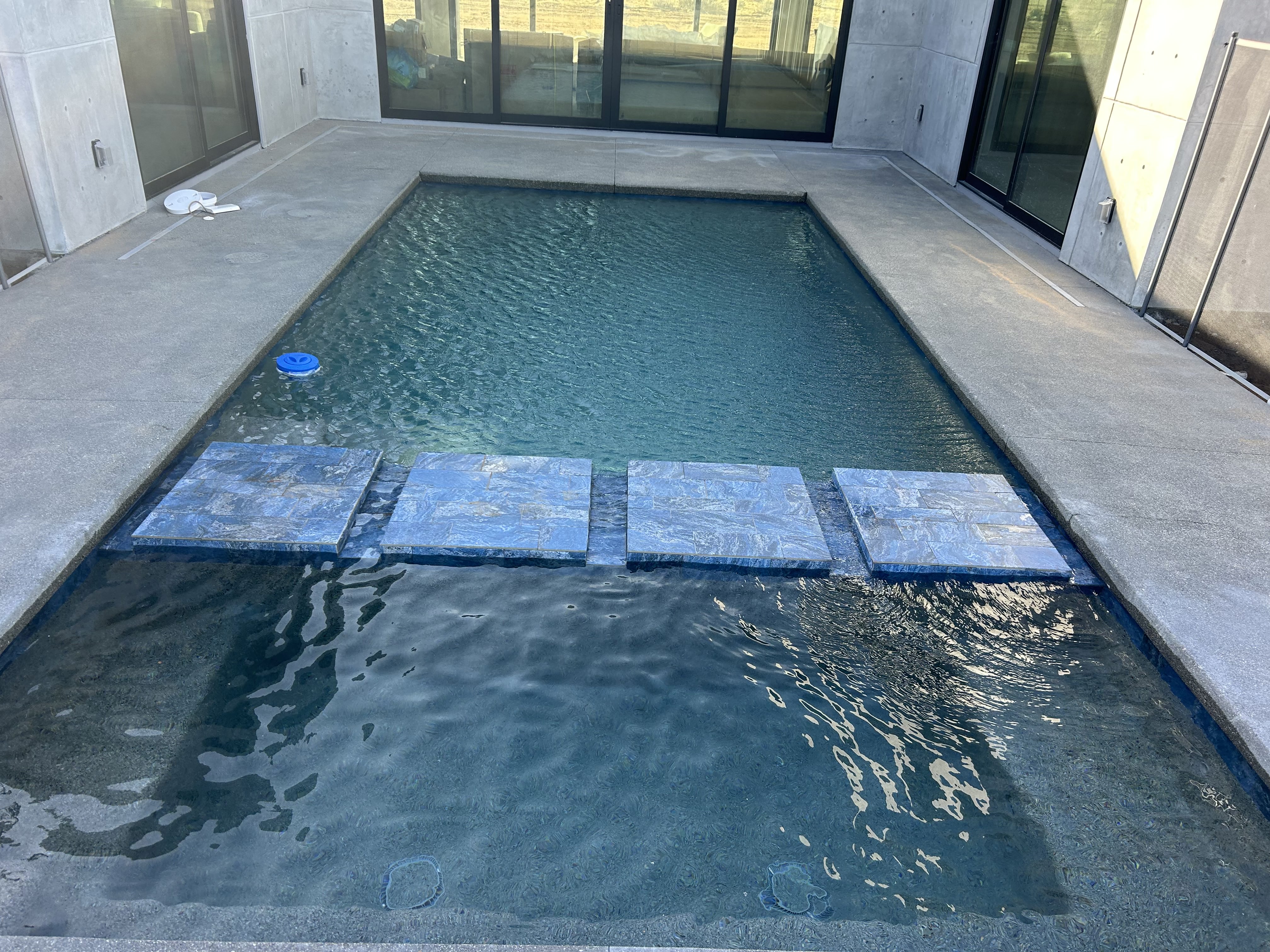 In-ground pool with walkway